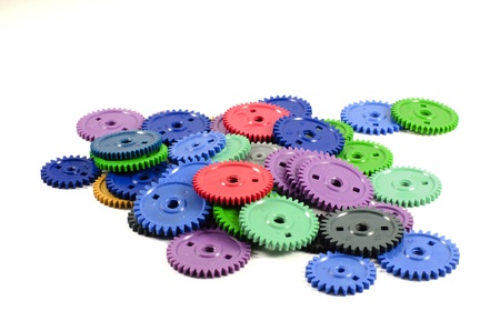 Heap colored gears isolated on a white backgroundの写真素材