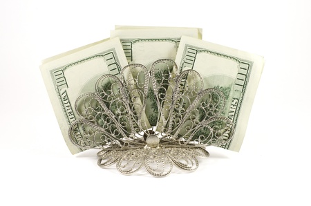 Napkin holder with three hundred dollars isolated on a white backgroundの写真素材