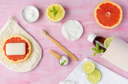 Zero waste bathroom accessories, reusable glass container, some citrus fruits around. Top view, layout.の写真素材