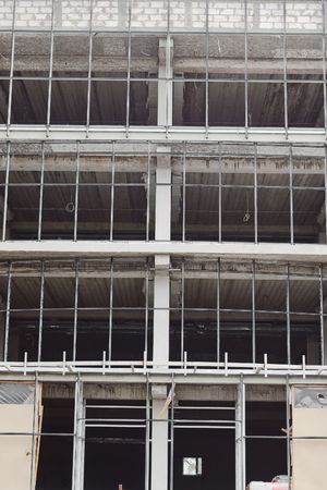 Window steel framework carcass on building under construction