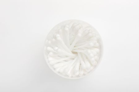 White cotton ear swabs with selective focus 