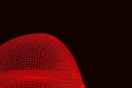 Abstract red curved spherical metal grid structure isolated on black with selective focusの写真素材