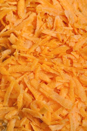 Freshly grated carrots background with selective focusの写真素材