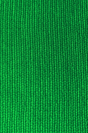 Vertical closeup of seamless green knitted fabric textureの写真素材