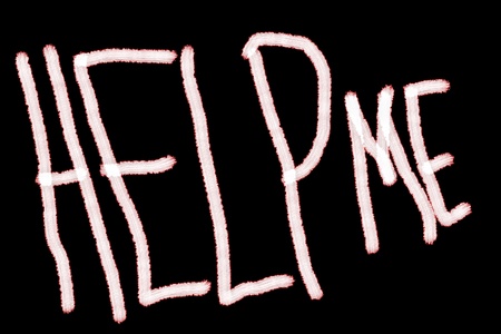 Grungy help me text drawn by white brush on black backgroundの写真素材