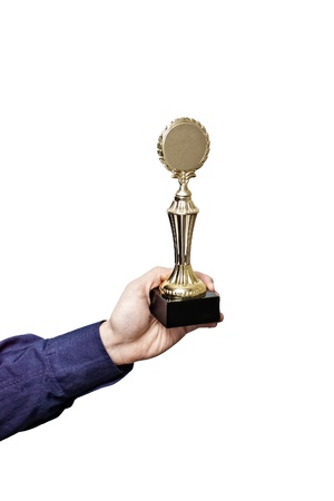 Hand in blue shirt sleeve holding golden laurel wreath trophy isolated on whiteの写真素材