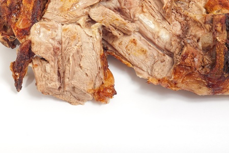 Closeup of roasted lamb leg with sliced piece of meat and copy space の写真素材