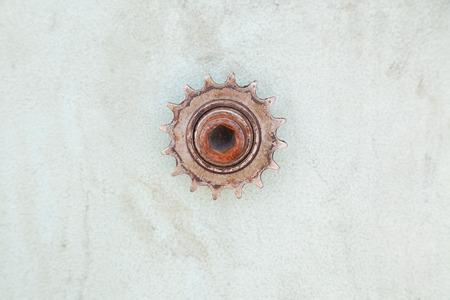 closeup of rusty gear on dirty wall with copy spaceの写真素材