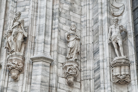 Grungy monuments at facade of the Cathedral of Milano, Duomo di Milano, Italy, fall 2014の写真素材