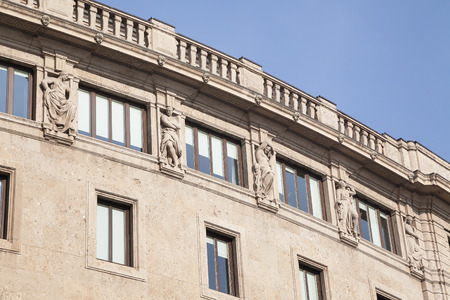 Antique facade with sculptures and blue sky