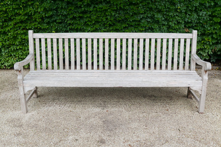Old vintage wooden bench in garden