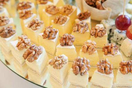 Closeup of cheese platter with walnuts and selective focusの写真素材