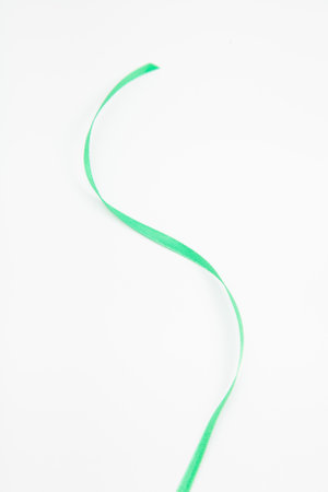 vertical green wavy ribbon on white