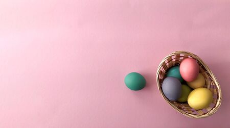 Template greeting card, copy Space for the holiday Easter eggs colorful on a pink background.の写真素材