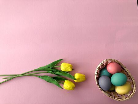 Template greeting card, copy Space for the holiday Easter eggs colorful on a pink background.の写真素材