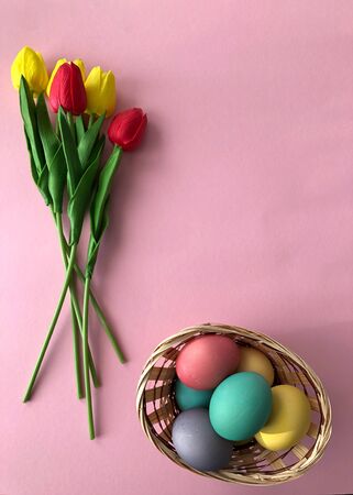 Template greeting card, copy Space for the holiday Easter eggs colorful on a pink background.の写真素材