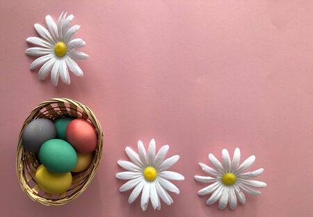 Template greeting card, copy Space for the holiday Easter eggs colorful on a pink background.の写真素材