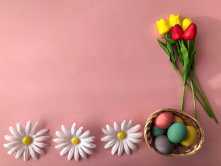 Template greeting card, copy Space for the holiday Easter eggs colorful on a pink background.の写真素材