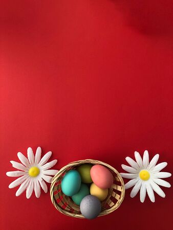 Template greeting card, copy Space for the feast of Easter, eggs colored with a red background.の写真素材