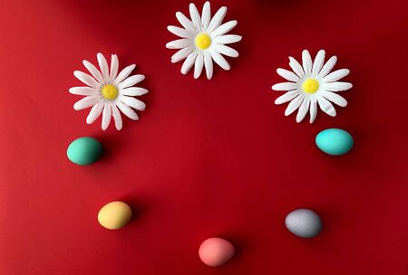 Template greeting card, copy Space for the feast of Easter, eggs colored with a red background.の写真素材