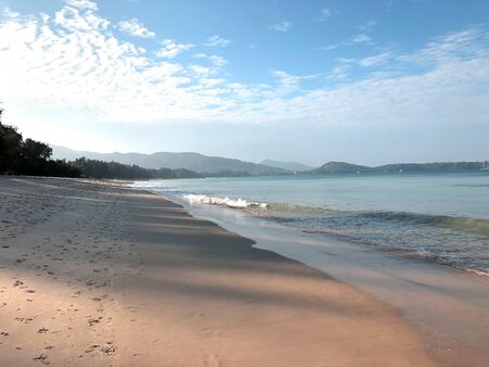 Beach and palm trees on the island of Phuket in Thailandの写真素材