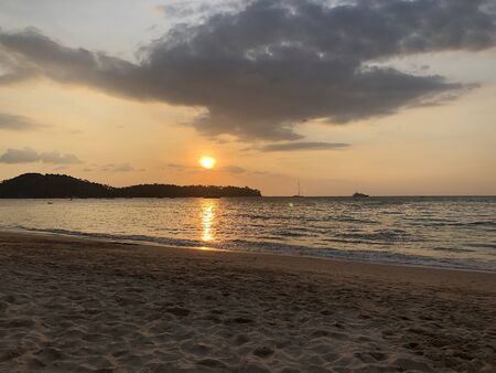 sunset on the ocean on the island of Phuketの写真素材