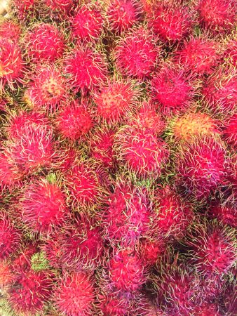 Photo rambutan on the counter supermarketの写真素材