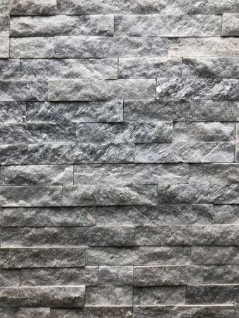 background, texture of an old brick gray-brown color. Used for walls