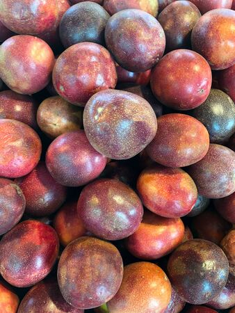 Photo of fruit of passion fruit on the counter of the supermarket