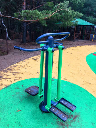 photo of street exercise machines for sports in the park