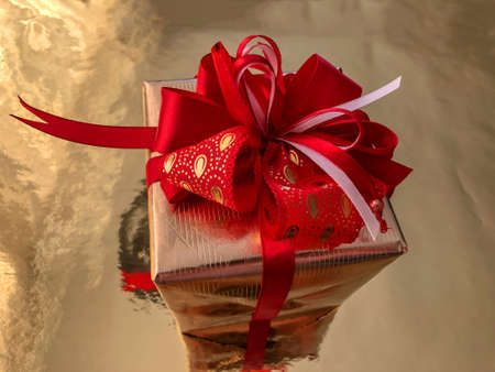 photo close-up Christmas boxes with presents on a gold background