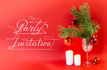 an invitation to the New Year, the Christmas party on a red backgroundの写真素材