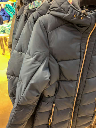 Women's clothing on a hanger in the store - coats, jackets, blousesの写真素材