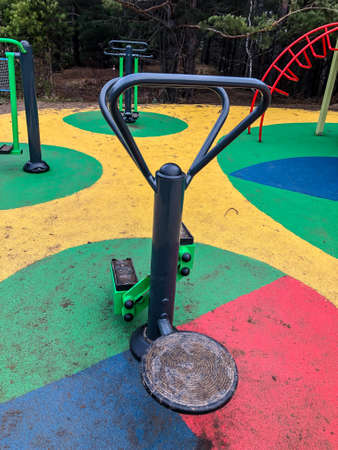 playground, slides, swings, a ladder in city parkの写真素材