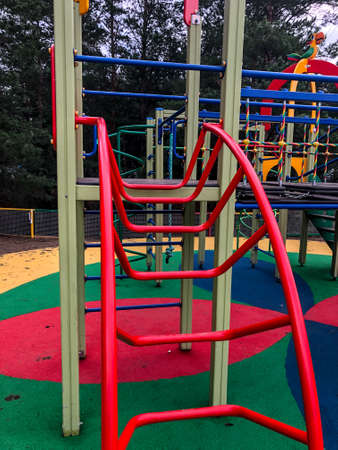 playground, slides, swings, a ladder in city parkの写真素材