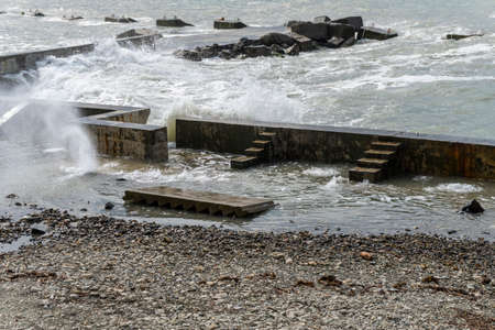 small storm on the sea, waves hitting the shore