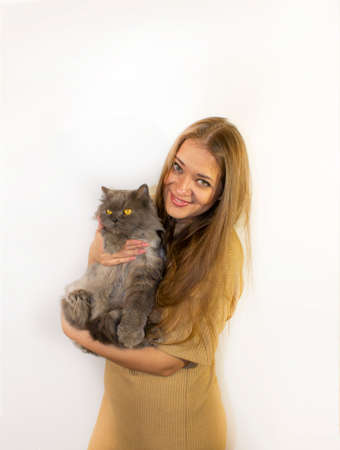young beautiful woman with a cat, visiting a veterinarian, beloved catの写真素材