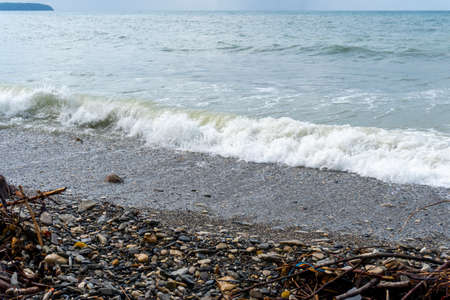 small storm on the sea, waves hitting the shore