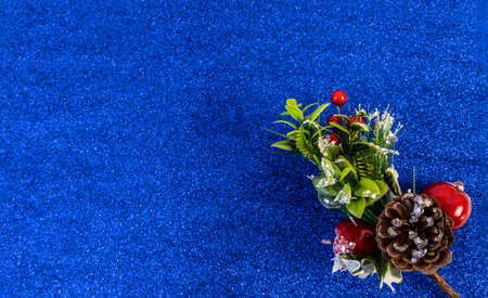 christmas and new year flat lay with copy space and with a new year toy on a blue backgroundの写真素材