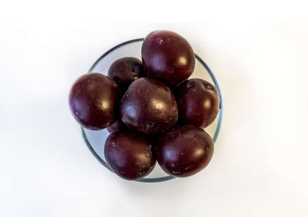 photo of plum on a plate, isolateの写真素材