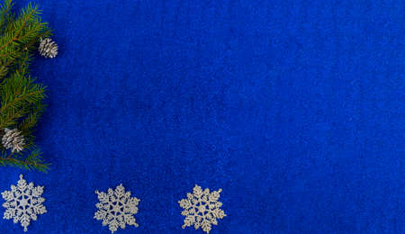 christmas and new year flat lay with copy space and with a new year toy on a blue background