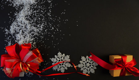 beautiful black christmas background for postcards, flyers, banners. Christmas tree branch and Christmas balls and toysの写真素材