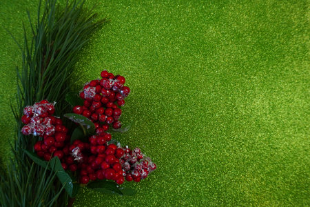 green christmas background with fir tree branch and christmas balls and toysの写真素材