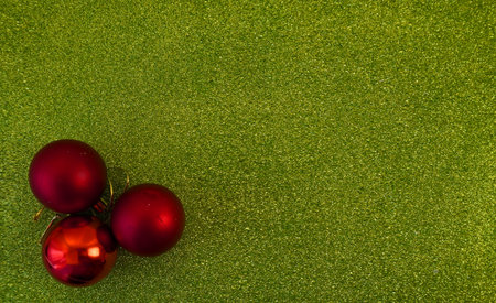 green christmas background with fir tree branch and christmas balls and toysの写真素材