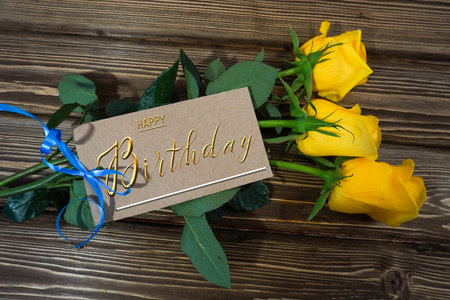postcard , Internet banner with a birthday greeting, with the inscription - happy birthday, a bouquet of flowers with a note of congratulations, rosesの写真素材