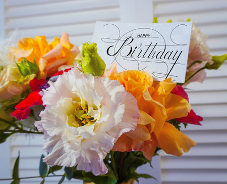 postcard , Internet banner with a birthday greeting, with the inscription - happy birthday, a bouquet of flowers with a note of congratulationsの写真素材