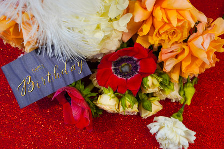 postcard , Internet banner with a birthday greeting, with the inscription - happy birthday, a bouquet of flowers with a note of congratulationsの写真素材