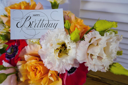 postcard , Internet banner with a birthday greeting, with the inscription - happy birthday, a bouquet of flowers with a note of congratulationsの写真素材