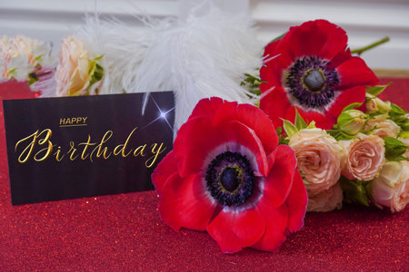postcard , Internet banner with a birthday greeting, with the inscription - happy birthday, a bouquet of flowers with a note of congratulationsの写真素材