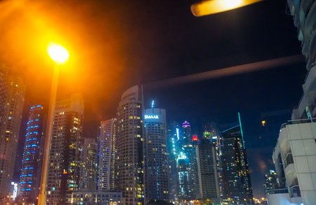 Dudai, UAE - March,18,2023: Dubai streets, houses and skyscrapers, view at nightのeditorial素材